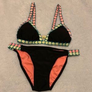 A black and colorful strapped bikini